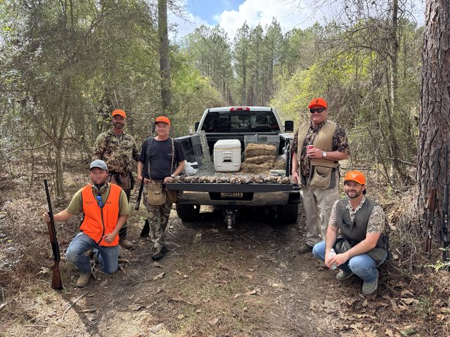 End-of-hunt group photo at the tailgate.